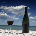 Wine glasses standing on seacoast